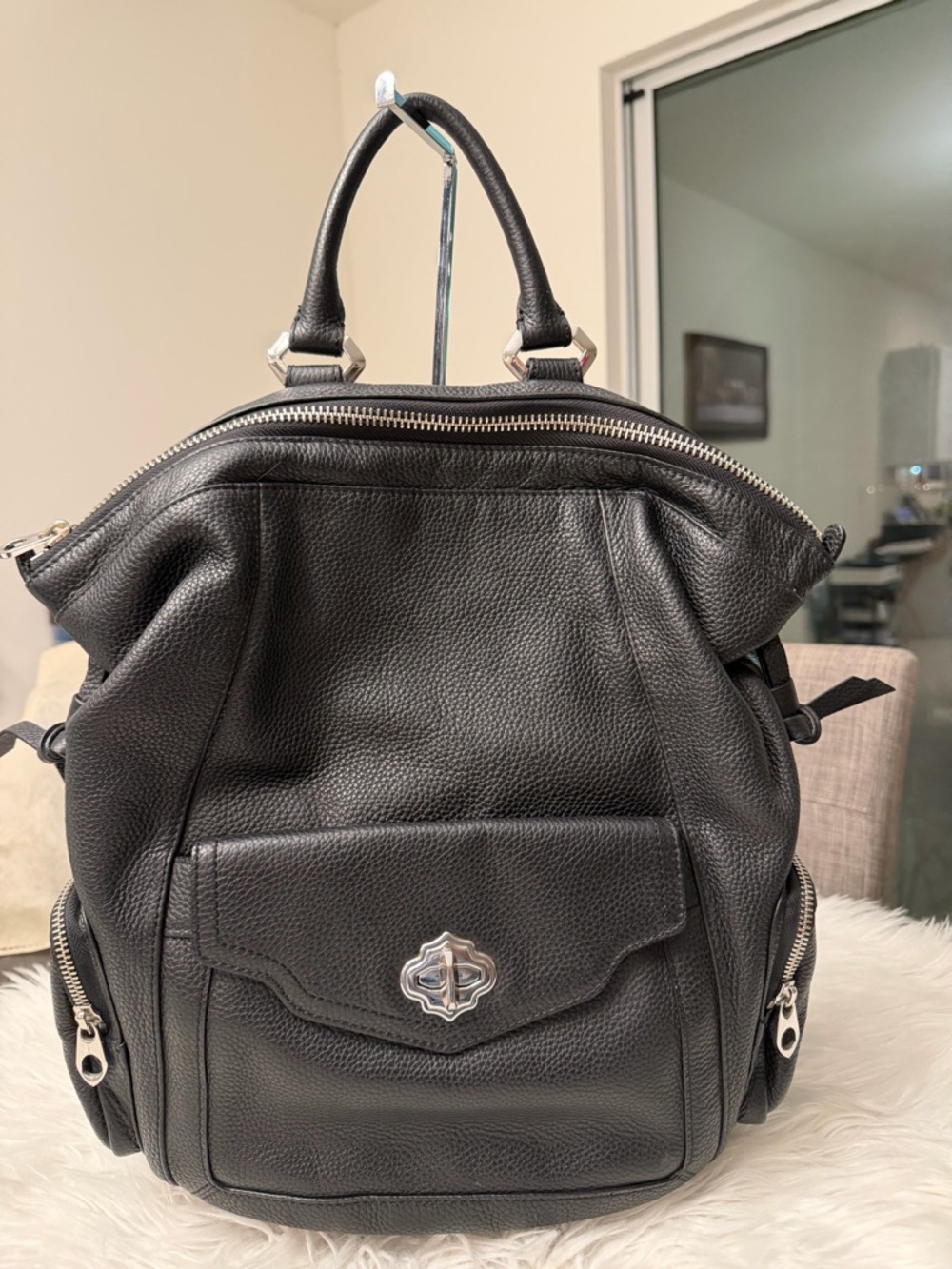 Oryany Black Pebbled Leather Backpack with Silver Hardware